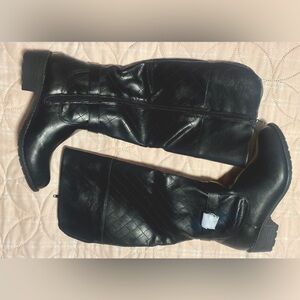 Brand new tall black boots never been worn. Size 7.5